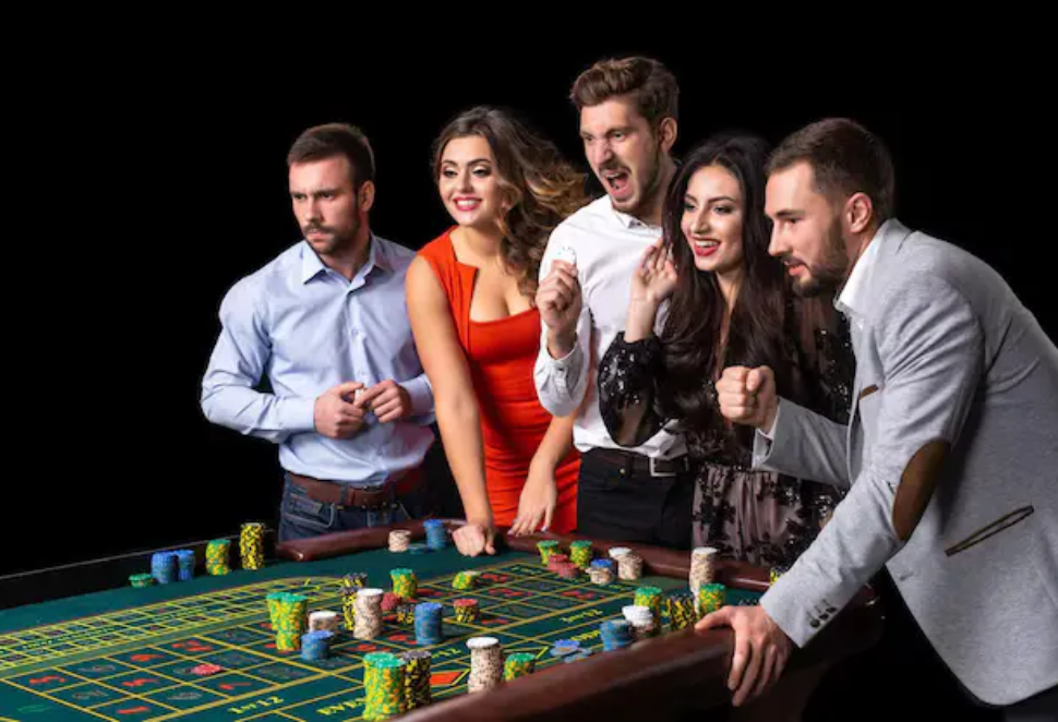 group-young-people-roulette-table-casino-black-background_639032-2836